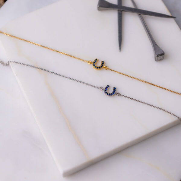 STERLING SILVER HORSESHOE BRACELET WITH BLUE ZIRCON AND CHAIN